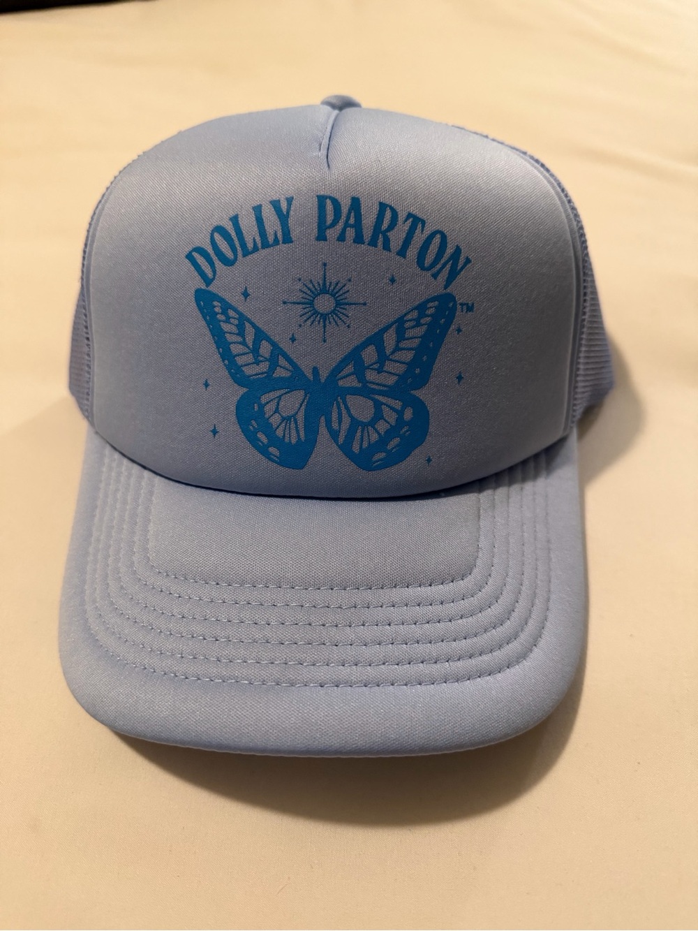 New Dolly Parton Light Blue Trucker Cap with Butterfly Logo